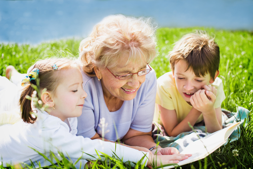 grandmother reading to children